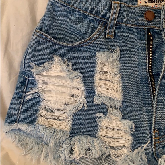 Light/medium wash mid rise denim short. - Picture 2 of 3